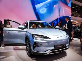 Visitors look at a BYD Seal U electric car at the IAA Mobility 2023 international motor show in Munich, Germany.