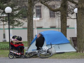 A homeless man in a tent next to the property beside the Supreme Court of Canada in Ottawa.