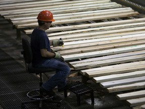 An employee monitors production at the West Fraser Timber Co. Ltd. sawmill in Quesnel, B.C.