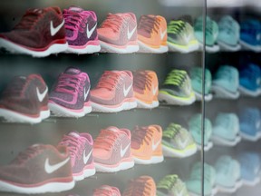 Nike Inc. 'Free' model sneakers on display in the window of the Nike Store inside the Westfield London shopping mall in the U.K.