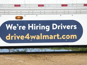 An ad for drivers is displayed on a Walmart truck in Richland, Miss., Wednesday, Sept. 6, 2023. On Thursday, the Labor Department reports on the number of people who applied for unemployment benefits last week.