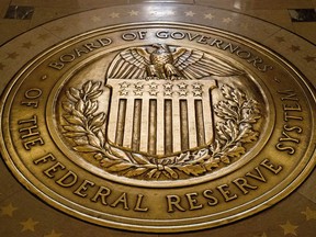 FILE- The seal of the Board of Governors of the United States Federal Reserve System is displayed in the ground at the Marriner S. Eccles Federal Reserve Board Building in Washington, Feb. 5, 2018. Since Federal Reserve officials last met in July, the economy has moved in the direction they hoped to see: Inflation continues to ease, if more slowly than before, while growth remains solid and the job market cools.