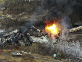FILE - This photo taken with a drone shows portions of a Norfolk Southern freight train that derailed the night before in East Palestine, Ohio, still on fire at mid-day on Feb. 4, 2023. The railroad industry is trying to make sure that emergency responders can quickly look up what is on a train when they respond to a derailment. In the chaos after a Norfolk Southern train derailed and caught fire in eastern Ohio in February, firefighters couldn't find that information for roughly 45 minutes.