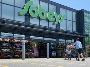 Empire Co. Ltd. says it earned $261.0 million in its latest quarter, up from $187.5 million in the same quarter last year, boosted by the sale of its 56 gas stations in Western Canada to Shell Canada. Shoppers at a west-end Toronto Sobeys grocery store, Sunday, June 26, 2023.