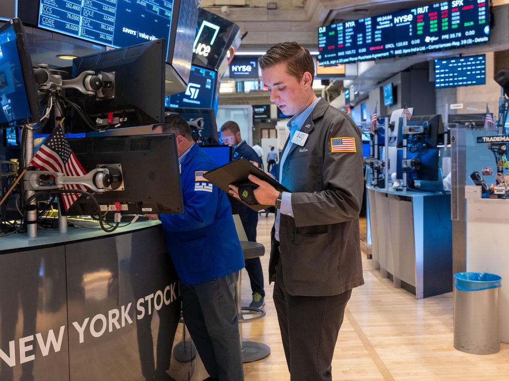 Traders work on the floor of the New York Stock Exchange.
