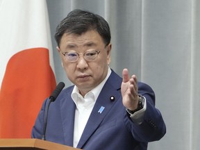 Japan's Chief Cabinet Secretary Hirokazu Matsuno attends a press conference in Tokyo Friday, Sept. 1, 2023. Japan's government announced Friday it will impose sanctions against three groups and four individuals for supporting North Korea's missile and nuclear development program. (Kyodo News via AP)