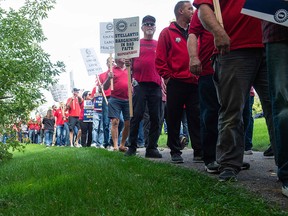 Members of the United Auto Workers (UAW) picket in front of Stellantis headquarters in Auburn Hills, Michigan, on Sept. 20, 2023. The union is expanding its strike against Stellantis and General Motors Co.