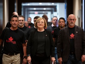 Unifor national president Lana Payne leads the way towards a meeting with Stellantis as part of the auto talks in Toronto on Thursday, Aug.10, 2023.