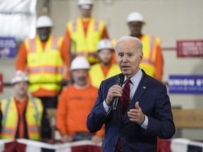 FILE - President Joe Biden delivers remarks on his economic agenda at a training center run by Laborers' International Union of North America, Feb. 8, 2023, in Deforest, Wis. The Biden administration on Friday, Sept. 29, is releasing a playbook on best practices for training workers -- as the low 3.8% unemployment rate and years of underinvestment have left manufacturers, construction firms and other employers with unfilled jobs.