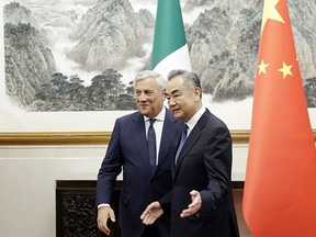 In this photo released by Ministry of Foreign Affairs of the People's Republic of China, China's Foreign Minister Wang Yi, right, meets with Italian Deputy Premier and Foreign Minister Antonio Tajani in Beijing Tuesday, Sept. 4, 2023. China's foreign minister is seeking to sell his Italian counterpart on the benefits of leader Xi Jinping's signature "Belt and Road" initiative of Chinese-built and -funded infrastructure projects, as Rome considers whether to renew the agreement. (Ministry of Foreign Affairs of the People's Republic of China via AP)