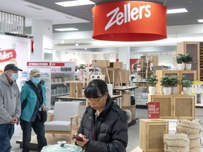 Hudson's Bay says it is expanding its Zellers brand to a slew of its department stores. Shoppers wander through a newly opened Zellers store in Scarborough Town Centre Mall, in Toronto, Thursday, March 23, 2023.