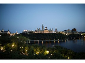 Parliament Hill stands at night in Ottawa, Ontario, Canada, on Thursday, Aug. 16, 2018. It makes sense for the U.S. and Mexico to meet bilaterally on Nafta on certain issues and Canada looks forward to rejoining talks on the trilateral pact in the coming days and weeks, Prime Minister Justin Trudeau said. Photographer: Brent Lewin/Bloomberg