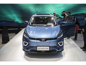 The WM Motor Technology Co. EX5 electric sport utility vehicle (SUV) stands on display at the Auto Shanghai 2019 show in Shanghai, China, on Tuesday, April 16, 2019. China's annual auto show, held in Shanghai this year, opened to the media on Tuesday amid the specter of an electric-car bubble and as the world's largest auto market trudges through its first recession in a generation. Photographer: Qilai Shen/Bloomberg