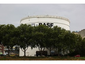 The BASF SE logo sits on a storage silo at the company's chemical plant on the River Rhine in Ludwigshafen, Germany, on Thursday, Aug. 13, 2020. Around 30% of Germany's coal, iron ore and natural gas is transported along the river, where factories are set up to take deliveries for just-in-time manufacturing. Photographer: Alex Kraus/Bloomberg
