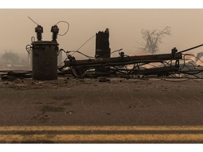 A utility box and pole destroyed by the Dixie Fire in Greenville, California, U.S., on Friday, Aug. 6, 2021. The Dixie Fire, which troubled utility giant PG&E Corp. said may have been sparked by one of its power lines, ripped through the gold-rush-era hamlet of Greenville late Wednesday, leveling buildings, melting street lamp posts and leaving downtown in ruins, according to local news reports.