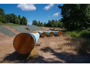 BENT MOUNTAIN, VIRGINIA - AUGUST 31: Sections of 42 diameter sections of steel pipe of the Mountain Valley Pipeline, MVP, lie on wooden blocks, August 31, 2022 in Bent Mountain, Virginia. The MVP will transport natural gas through 303 miles of West Virginia and Virginia. Public opposition has centered on challenging MVPs permitting through wetlands and national forests. The original budget of $3.5 billion is now estimated to be $6.2 billion. The Federal Energy Regulatory Control agency, FERC, has recently granted MVP another 4-years to complete.