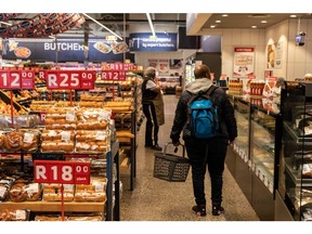 A customer shops for baked goods inside a new Pick n Pay Stores Ltd. QualiSave supermarket in Cape Town, South Africa, on Monday, Aug. 15, 2022. Pick n Pay in May said it was revamping stores, targeting 3 billion rand ($181 million) of savings and seeking to be clearer in how it approached different target markets.