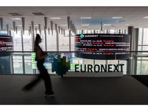 Stock price information displayed above a trading floor at the Euronext NV stock exchange in Paris, France, on Tuesday, Aug. 1, 2023. France's finance minister Bruno Le Maire said talks with officials in China this weekend were positive and called for Chinese companies to invest more into Europe, especially in electric vehicles and other sectors to combat climate change.