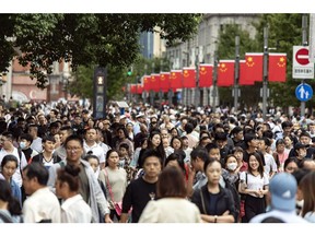 Pedestrians and shoppers on Nanjing Road shopping street in Shanghai, China, on Tuesday, Oct. 3, 2023.  Source: Bloomberg