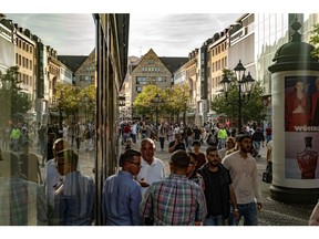 Shoppers walk along a pedestrianized shopping street in Nuremberg, Germany. Photographer: Ben Kilb/Bloomberg