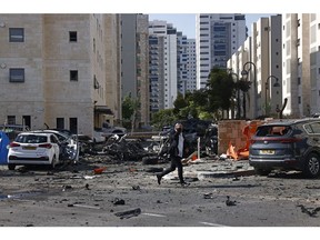 Cars damaged during a rocket attack in Ashkelon, Israel, on Oct. 7.