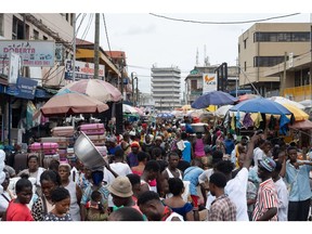Crowds make their way along a busy market street in Accra, Ghana on Monday, Oct. 9, 2023. Ghana is scheduled to release consumer price index figures on Oct. 11. Photographer: Ernest Ankomah/Bloomberg