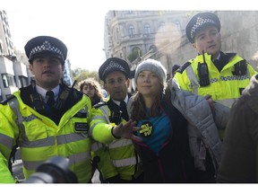 Police arrest Greta Thunberg during a protest organised by Fossil Free London on Oct. 17.