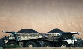 BHP CEO says Canada 'really attractive,' hopes to invest beyond potash 13 Trucks carrying coal pass each other at a BHP mine in Australia.