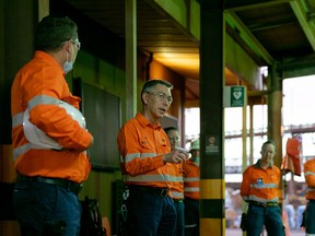 BHP chief executive Mike Henry, centre.