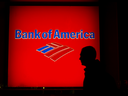 The silhouette of a pedestrian is seen walking past a Bank of America Corp. branch at night in New York City. Among the U.S. big banks, Bank of America Corp. has been the worst performer. 
