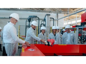 Roland Lescure, French Minister of Industry (left) accompanied by Emmanuel Ladent, CEO Carbios (far right) and representatives of Carbios partner brands (On, Salomon and Puma), inaugurates the textile preparation line for biorecycling.