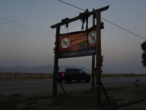A sign calling for the boycott of carrots stands outside the Cuyama Buckhorn restaurant and hotel, Wednesday, Sept. 20, 2023, in New Cuyama, Calif.