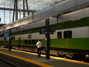 A man walks along an empty platform as a train stands idle at Toronto's Union Station after GO Transit and UP Express announced that trains are not running on the entire network due to a networkwide system failure on Tuesday October 3, 2023.