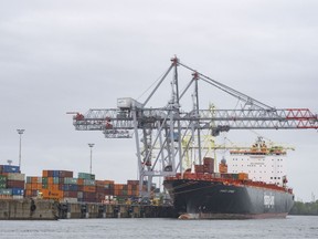 A container ship is loaded in the Port of Montreal, Tuesday, Sept. 19, 2023. Unifor says the St. Lawrence Seaway is poised to shut down ashundreds of workers walk off the job today.