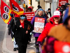 PSAC workers and supporters picket in front of President of the Treasury Board Mona Fortier's office in Ottawa on Friday, April 21, 2023.
