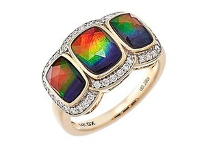 Stunning 14k yellow gold ring, featuring one 8x6mm and two 7x5mm cushion shaped top grade Ammolite gemstones, with white diamond accents.