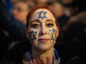 A woman with the Star of David painted on her face