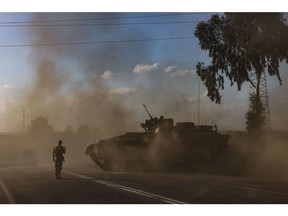 An Israeli tank maneuvers near the border with Gaza on Oct. 15, 2023. Photographer: Menahem Kahana/AFP/Getty Images