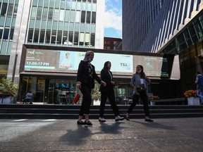 A sign board displays the Toronto Stock Exchange in the financial district in Toronto.