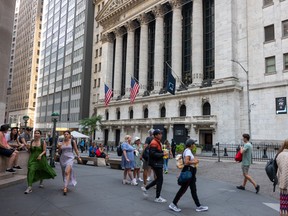 People walking outside of the New York Stock Exchange.