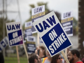 United Auto Workers members strike the General Motors Co. Lansing Delta Assembly Plant on in Lansing, Michigan.