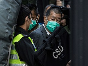 Hong Kong media tycoon Jimmy Lai being escorted into a Hong Kong Correctional Services van outside the Court of Final Appeal after being ordered to remain in jail while judges consider his fresh bail application.