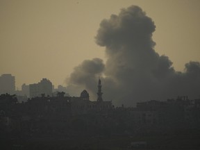 Smoke rises following an Israeli airstrike in the Gaza Strip, as seen from southern Israel, Oct. 23, 2023.