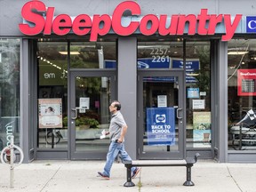A man walks past a Sleep Country Canada Holdings store in Toronto.