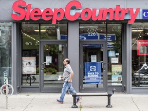 A man walks past a Sleep Country Canada Holdings store in Toronto.
