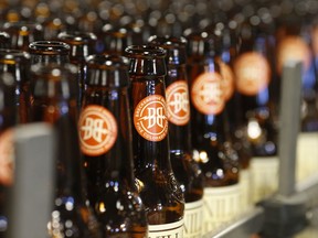 FILE - Empty bottles head down the line to be washed in the factory of Breckenridge Brewery in Littleton, Colo., on Thursday, Jan. 21, 2016. The cannabis company Tilray expanded its position in the craft brew industry with the acquisition of eight beer and beverage brands from Anheuser-Busch, including Breckenridge Brewery. Tilray said that the transaction, which was announced in August 2023, will triple its beer sales volume from four million cases to 12 million.