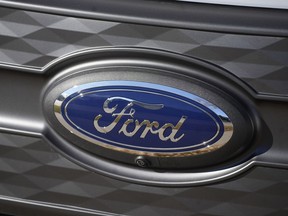 FILE - The Ford company logo is shown on Thursday, Nov. 25, 2022, outside a Ford dealership in southeast Denver. Ford is recalling more than 238,000 Explorers in the U.S. because a rear axle bolt can fail, potentially causing a loss of drive power or allowing the SUVs to roll away while in park. The recall on Friday, Oct. 13, 2023, comes after U.S. safety regulators opened an investigation into the problem after getting two complaints that repairs didn't work in two previous recalls this year and in 2022.