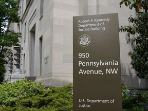 FILE - The exterior of the Robert F. Kennedy Department of Justice building is pictured on May 4, 2021, in Washington. U.S. regulators on Monday, Oct. 30, 2023, sued SolarWinds, a Texas-based technology company whose software was breached in a massive 2020 Russian cyberespionage campaign, for fraud for failing to disclose security deficiencies ahead of the stunning hack. Detected in December 2020, the SolarWinds hack penetrated U.S. government agencies, including the Justice and Homeland Security departments, and more than 100 private companies and think tanks. It was a rude wake-up call on the perils of neglecting cybersecurity.