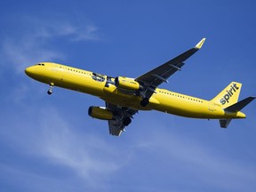 FILE - A Spirit Airlines jet approaches Philadelphia International Airport in Philadelphia, Feb. 24, 2021. Spirit Airlines canceled about 100 flights on Friday, Oct. 20, 2023, after pulling some planes out of service for inspections, and the airline expects the disruptions to last several days.