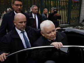 Poland's conservative ruling Law and Justice party leader Jaroslaw Kaczynski gets in a car after voting during parliamentary elections in Warsaw, Poland, Sunday, Oct. 15, 2023. Poland is holding a high-stakes election on Sunday that has energized many voters, with the ruling conservative nationalist party pitted against opposition groups that accuse it of eroding the foundations of the democratic system.